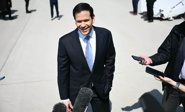 Secretary of State Marco Rubio speaks to reporters before boarding a plane at Joint Base Andrews, Md., Thursday, March 26, 2026. (Brendan Smialowski/Pool Photo via AP)