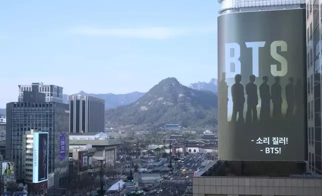 A screen promoting a comeback concert of K-pop boy group BTS is seen near Gwanghwamun Square in Seoul, South Korea, Thursday, March 19, 2026. (AP Photo/Ahn Young-joon)