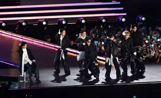 K-pop boy band BTS perform onstage during comeback concert at Gwanghwamun Square on March 21, 2026 in Seoul, South Korea. (Kim Min-Hee/Pool Photo via AP)