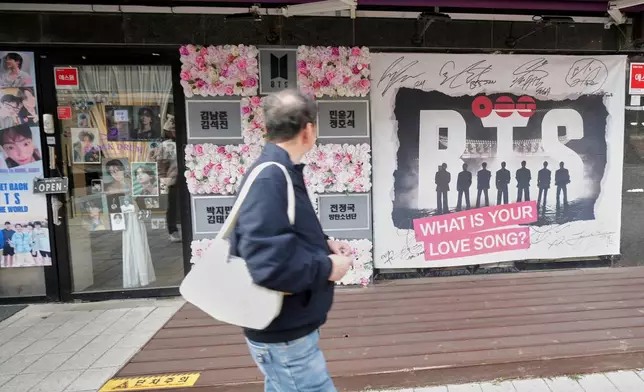 A man walks past a cafe in Seoul, South Korea, Tuesday, March 17, 2026. (AP Photo/Lee Jin-man)