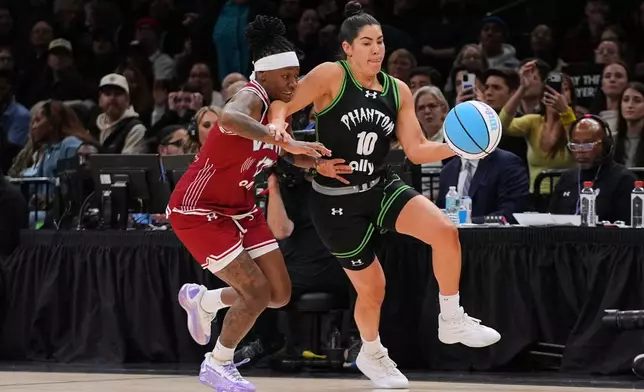 Phantom BC guard Kelsey Plum (10) drives past Vinyl BC guard Erica Wheeler (17) during the second half of a semifinal in their Unrivaled 3-on-3 basketball game, Monday, March 2, 2026, in New York. (AP Photo/Frank Franklin II)
