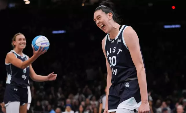 Mist BC wing Breanna Stewart (30) celebrates with teammate Alanna Smith (8) after scoring during the second half of a semifinal in an Unrivaled 3-on-3 basketball game against Breeze BC, Monday, March 2, 2026, in New York. (AP Photo/Frank Franklin II)