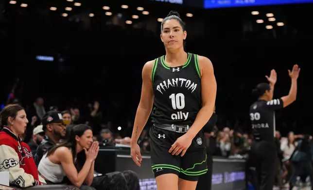 Phantom BC guard Kelsey Plum (10) reacts after making the game-winning shot during the second half of a semifinal in their Unrivaled 3-on-3 basketball game against Vinyl BC, Monday, March 2, 2026, in New York. (AP Photo/Frank Franklin II)