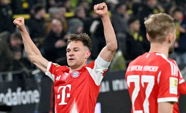 Bayern Munich's Joshua Kimmich celebrates scoring during the Bundesliga soccer match between Borussia Dortmund and FC Bayern Munich in Dortmund, Germany, Saturday Feb. 28, 2026. (Federico Gambarini/dpa via AP)