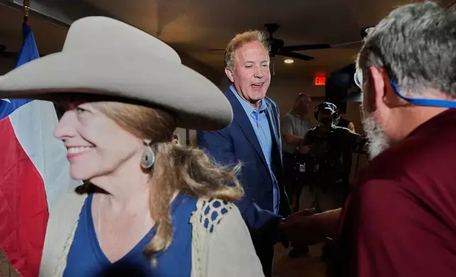 Texas Attorney General Ken Paxton, a Republican candidate for the U.S. Senate, greets supporters during a campaign stop, in Waco, Texas, Monday, March 2, 2026. (AP Photo/Tony Gutierrez)