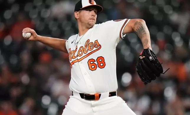 Baltimore Orioles pitcher Tyler Wells delivers during the ninth inning of a baseball game against the Texas Rangers, Monday, March 30, 2026, in Baltimore. (AP Photo/Stephanie Scarbrough)