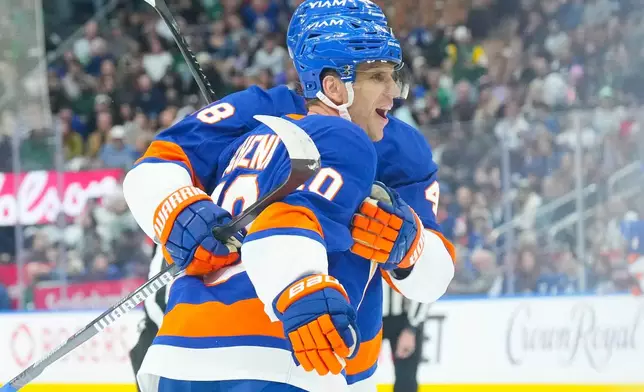 New York Islanders' Brayden Schenn celebrates his goal against the Toronto Maple Leafs during the first period of an NHL hockey game in Toronto, Tuesday March 17, 2026. (Chris Young/The Canadian Press via AP)
