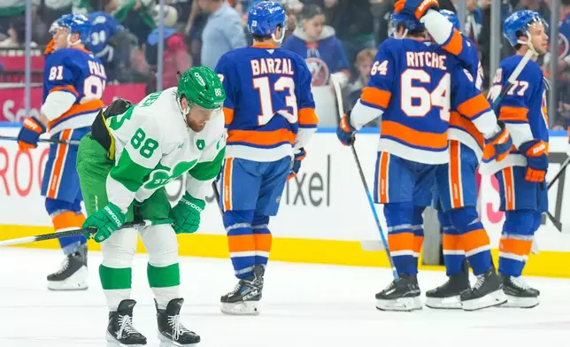 Toronto Maple Leafs' William Nylander (88) reacts at the final buzzer as New York Islanders celebrate their win during an NHL hockey game in Toronto, Tuesday March 17, 2026. (Chris Young/The Canadian Press via AP)