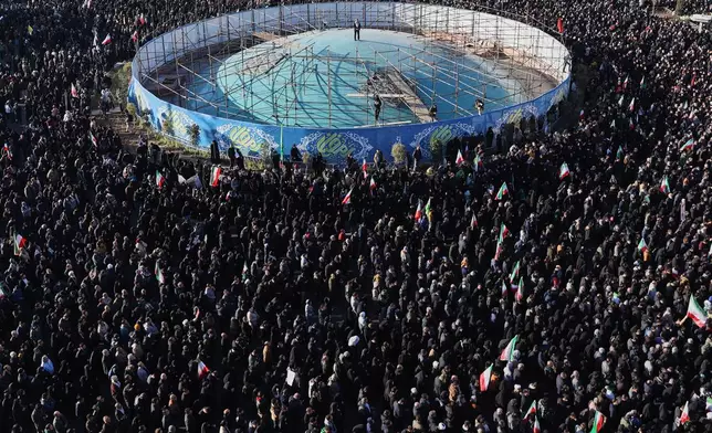 Government supporters gather in mourning after state TV officially announced the death of Iranian Supreme Leader Ayatollah Ali Khamenei, in Tehran, Iran, Sunday, March 1, 2026. (AP Photo/Vahid Salemi)