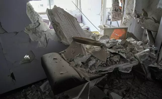 Debris is seen in a room of Gandhi Hospital, which was damaged when a strike hit a state TV communications tower and nearby buildings across the street during the ongoing joint U.S.-Israeli military campaign in Tehran, Iran, Monday, March 2, 2026. (AP Photo/Vahid Salemi)