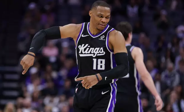 Sacramento Kings guard Russell Westbrook (18) reacts after making a three point basket against the New Orleans Pelicans during the first half of an NBA basketball game Thursday, March 5, 2026, in Sacramento, Calif. (AP Photo/Scott Marshall)