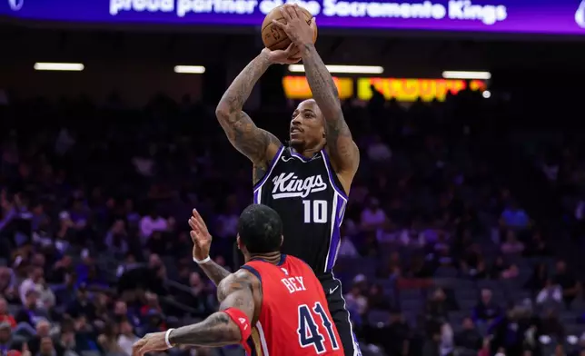 Sacramento Kings guard DeMar DeRozan (10) shoots over New Orleans Pelicans guard Saddiq Bey (41) during the second half of an NBA basketball game Thursday, March 5, 2026, in Sacramento, Calif. (AP Photo/Scott Marshall)
