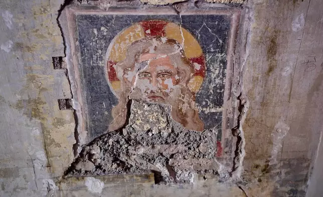 A fresco depicting Jesus Christ is visible inside the Basilica of San Pietro in Vincoli in Rome, Monday, March 9, 2026. (AP Photo/Domenico Stinellis)