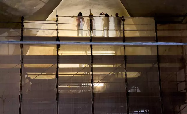 Journalists visit the Basilica of San Pietro in Vincoli in Rome during its restoration works, Monday, March 9, 2026. (AP Photo/Domenico Stinellis)