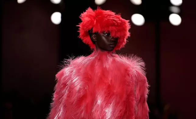 A model wears a creation from the Bottega Veneta Fall/Winter 2026-2027 Women's collection presented in Milan, Italy, Saturday, Feb. 28, 2026. (AP Photo/Luca Bruno)