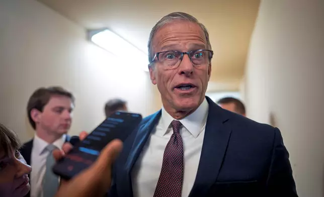 Senate Majority Leader John Thune, R-S.D., is met by reporters after a closed door meeting with fellow Republicans on the Homeland Security budget stalemate, at the Capitol in Washington, Thursday, March 26, 2026. (AP Photo/J. Scott Applewhite)