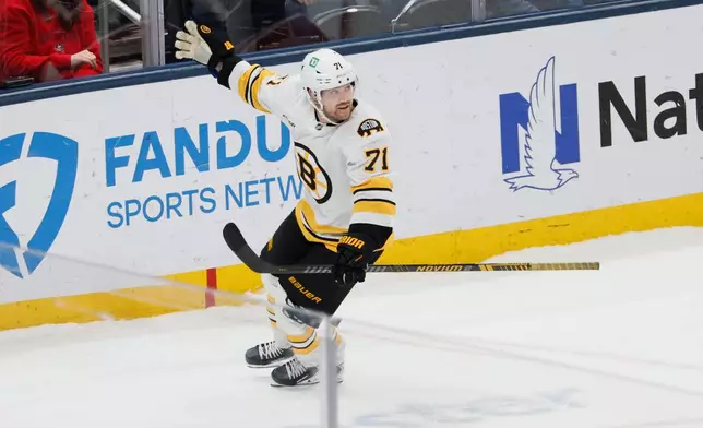 Boston Bruins' Viktor Arvidsson celebrates his game-winning goal against the Columbus Blue Jackets during the shootout of an NHL hockey game, Sunday, March 29, 2026, in Columbus, Ohio. (AP Photo/Jay LaPrete)
