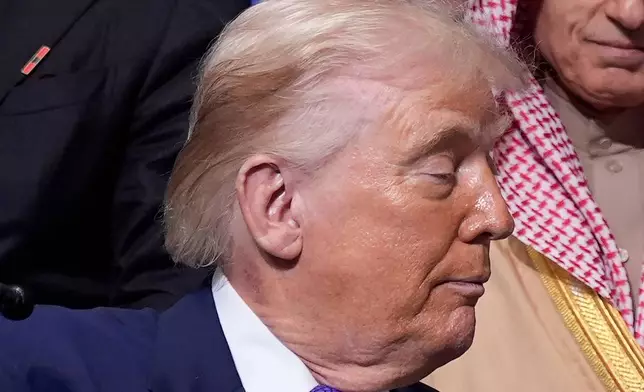 Redness is visible on the neck of President Donald as he attends a Board of Peace meeting at the U.S. Institute of Peace, Thursday, Feb. 19, 2026, in Washington. (AP Photo/Mark Schiefelbein)