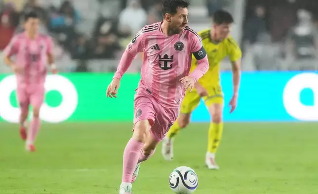 Inter Miami forward Lionel Messi (10) runs with the ball during the first half of a CONCACAF Champions Cup Round of 16 soccer match against Nashville, Wednesday, March 18, 2026, in Fort Lauderdale, Fla. (AP Photo/Marta Lavandier)