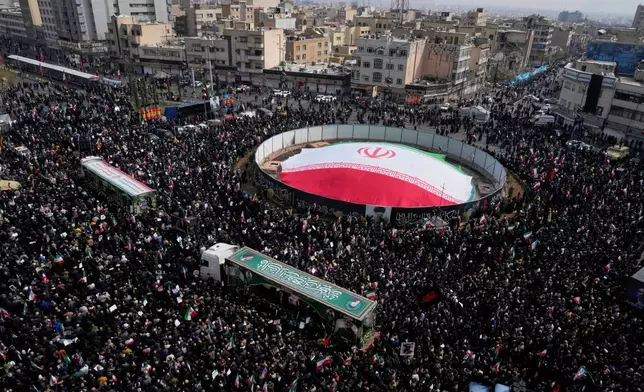 Mourners attend the funeral procession for senior Iranian military officials and some civilians killed during the U.S.-Israel campaign, in Tehran, Iran, Wednesday, March 11, 2026. (AP Photo/Vahid Salemi)