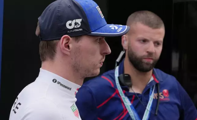 Red Bull driver Max Verstappen of the Netherlands walks out of the FIA office following a crash during the qualifying session for the Australian Formula One Grand Prix at Albert Park, in Melbourne, Australia, Saturday, March 7, 2026. (AP Photo/Asanka Brendon Ratnayake)