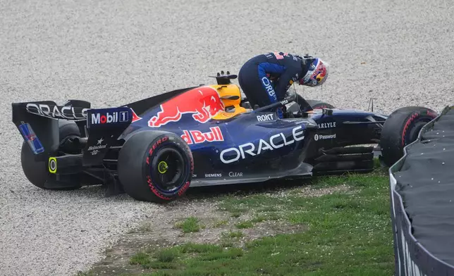 Red Bull driver Max Verstappen of the Netherlands gets out of his car after a crash during the qualifying session for the Australian Formula One Grand Prix at Albert Park, in Melbourne, Australia, Saturday, March 7, 2026. (AP Photo/Asanka Brendon Ratnayake)