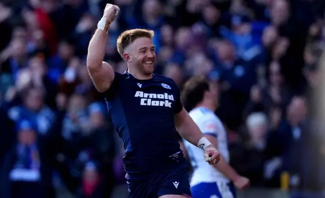 Scotland's Kyle Steyn celebrates scoring a try during the Six Nations rugby match between Scotland and France in Edinburgh, Scotland, Saturday March 7, 2026. (Andrew Milligan/PA via AP)