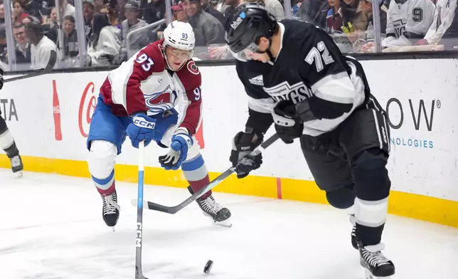 Colorado Avalanche center Zakhar Bardakov, left, chases Los Angeles Kings left wing Artemi Panarin during the first period of an NHL hockey game Monday, March, 2, 2026 in Los Angeles. (AP Photo/Ryan Sun)