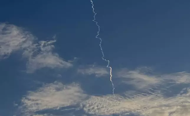 Israel's air defense missile fires to intercept missiles from Iran over Israel, Sunday, March 1, 2026. (AP Photo/Ariel Schalit)