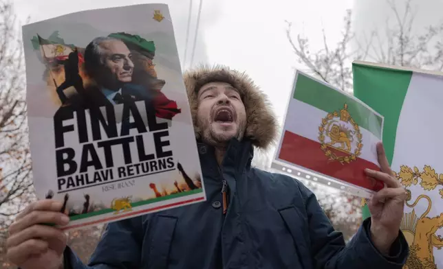 Iranian people attend a demonstration in support of the U.S. and Israeli strikes on Iran in front of Iranian Embassy in Yerevan, Armenia, Saturday, Feb. 28, 2026. (AP Photo/Anthony Pizzoferrato)