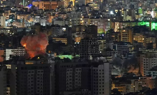Smoke and flames rise from the site of Israeli airstrikes in Dahiyeh, Beirut's southern suburbs, Lebanon, Thursday, March 5, 2026. (AP Photo/Hassan Ammar)