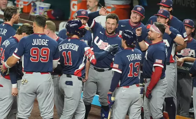 United States' Gunnar Henderson (11) celebrates his home run during the fourth inning of a World Baseball Classic semifinal game against the Dominican Republic, Sunday, March 15, 2026, in Miami. (AP Photo/Rebecca Blackwell)