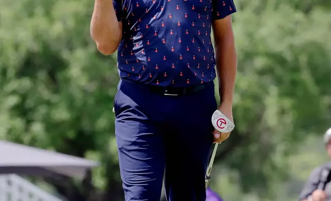 Gary Woodland pumps his fist after sinking a birdie putt on the ninth hole during the final round of the Texas Children's Houston Open golf tournament Sunday, March 29, 2026, in Houston. (AP Photo/Michael Wyke)