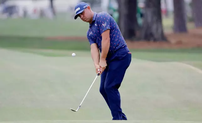 Gary Woodland chips onto the eighth green during the final round of the Texas Children's Houston Open golf tournament Sunday, March 29, 2026, in Houston. (AP Photo/Michael Wyke)