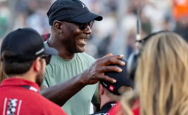 Team co-owner Michael Jordan celebrates by 23XI Racing's Tyler Reddick during a NASCAR Cup Series auto race in Austin, Texas, Sunday, March 1, 2026. (AP Photo/Stephen Spillman)