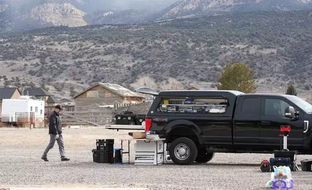 Authorities conduct an investigation at a home where a woman was found dead in Lyman, Utah, Thursday, March 5, 2026. (AP Photo/George Frey)