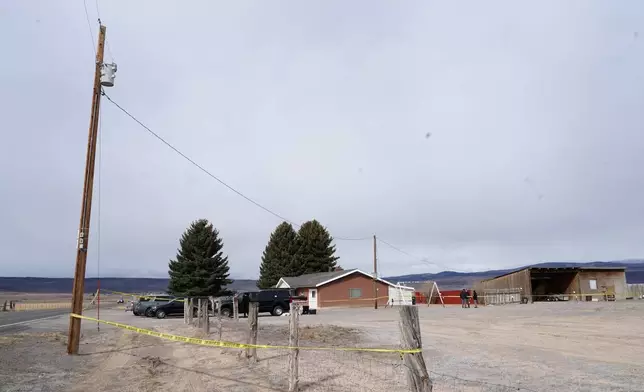 Police and investigators conduct an investigation at a home where a woman was found dead in Lyman, Utah, Thursday, March 5, 2026. (AP Photo/George Frey)