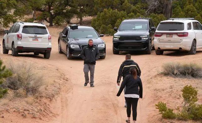 Authorities conduct an investigation Thursday, March 5, 2026, into the deaths of two women a day earlier on a trail just west of Capitol Reef National Park near Teasdale, Utah. (AP Photo/George Frey)