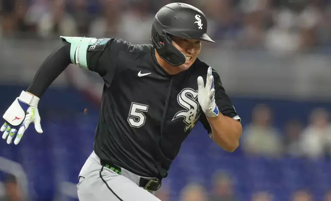 Chicago White Sox Munetaka Murakami (5) runs after hitting a single during the third inning of a baseball game against the Miami Marlins Monday, March 30, 2026, in Miami. (AP Photo/Marta Lavandier)