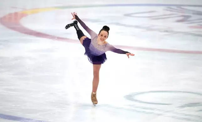 Stef Reid, a former Paralympic athlete who now does figure skating, competes in the British Adult Figure Skating Championships in Sheffield, England, Friday, Feb. 6, 2026. (AP Photo/Jon Super)
