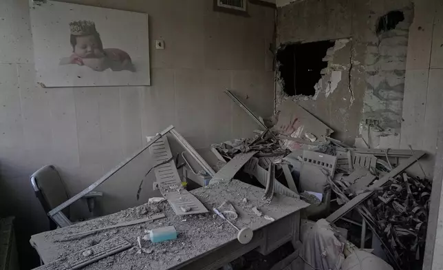 Debris is seen in a room of the Gandhi Hospital, which was damaged when a strike hit a state TV communications tower and nearby buildings across the street, during the ongoing joint U.S.-Israeli military campaign in Tehran, Iran, Monday, March 2, 2026. (AP Photo/Vahid Salemi)