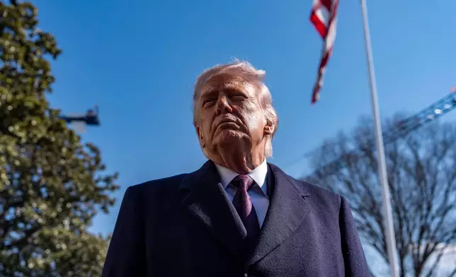 President Donald Trump speaks to reporters before departing on Marine One from the South Lawn of the White House, Friday, Feb. 27, 2026, in Washington. (AP Photo/Alex Brandon)