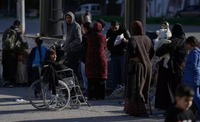Displaced families gather in Martyrs' Square after fleeing Israeli airstrikes in Dahiyeh, a southern suburb of Beirut, Lebanon, Monday, March 2, 2026. (AP Photo/Bilal Hussein)