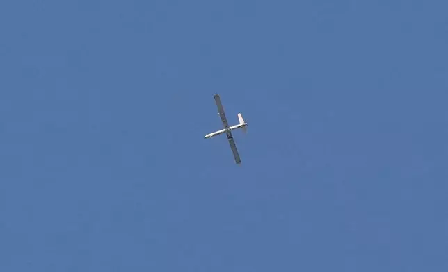 An Israeli drone flies over Dahiyeh, a southern suburb of Beirut, Lebanon, Monday, March 2, 2026. (AP Photo/Hassan Ammar)