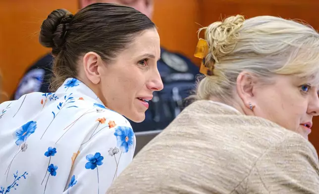 Defendant Kouri Richins, left, accused of poisoning her husband in March 2022, listens to closing arguments in Third District Court, Monday, March 16, 2026, in Park City, Utah. (David Jackson/Pool Photo via AP)