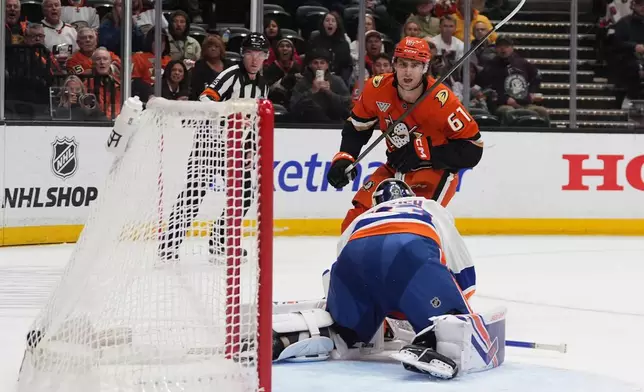 Anaheim Ducks left wing Cutter Gauthier (61) watches his shot get past New York Islanders goaltender David Rittich for a goal during the first period of an NHL hockey game against the New York Islanders Wednesday, March 4, 2026, in Anaheim, Calif. (AP Photo/Gregory Bull)