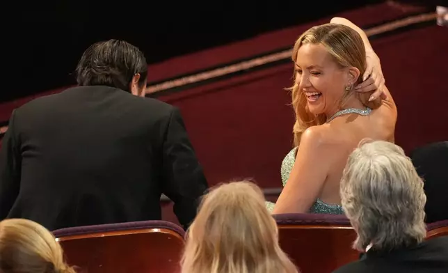 Danny Fujikawa, left, and Kate Hudson in the audience during the Oscars on Sunday, March 15, 2026, at the Dolby Theatre in Los Angeles. (AP Photo/Chris Pizzello)