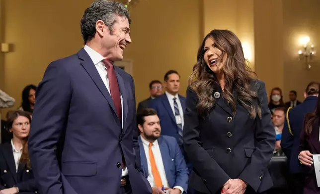FILE - Joseph Kent, director of the National Counterterrorism Center and Homeland Security Secretary Kristi Noem appear before the House Committee on Homeland Security on Capitol Hill in Washington, Dec. 11, 2025. (AP Photo/Mark Schiefelbein, File)