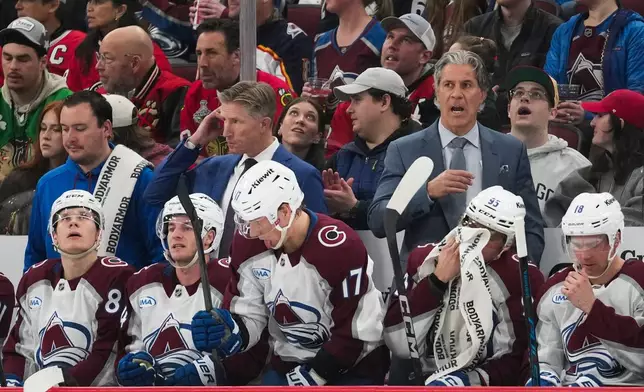 Colorado Avalanche head coach Jared Bednar, right, stands on the bench during the second period of an NHL hockey game against the Chicago Blackhawks, Friday, March 20, 2026, in Chicago. (AP Photo/Erin Hooley)