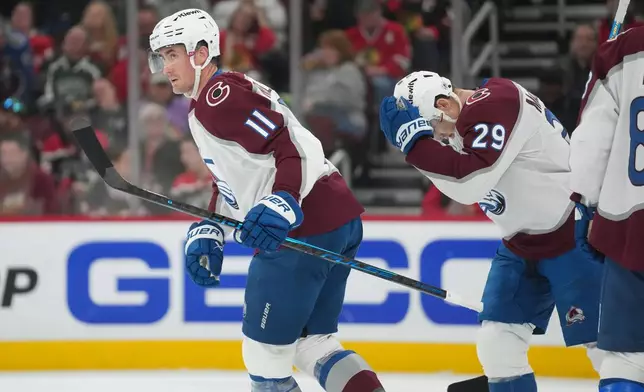 Colorado Avalanche center Brock Nelson (11) returns to the bench after scoring on the Chicago Blackhawks during the first period of an NHL hockey game Friday, March 20, 2026, in Chicago. (AP Photo/Erin Hooley)